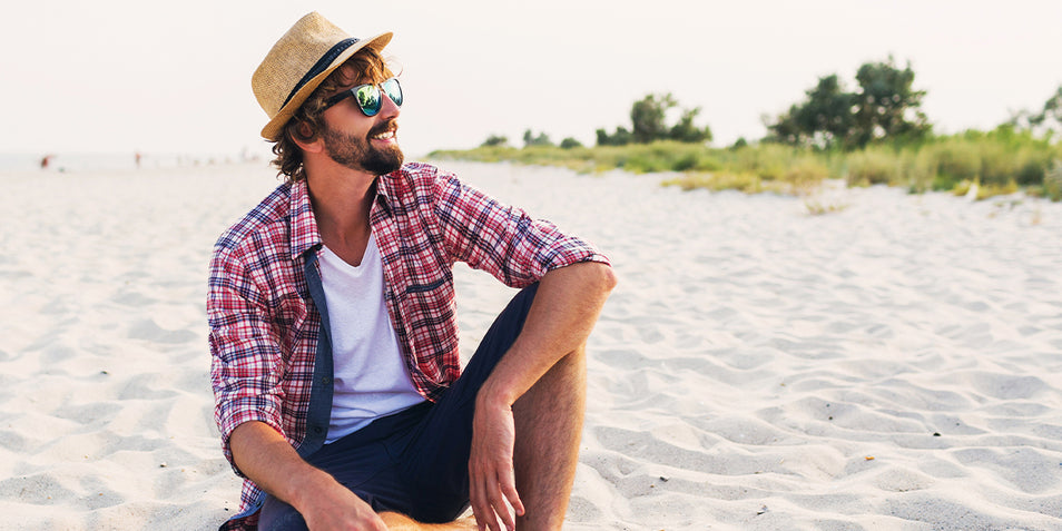 A guy enjoying the sun and his summer beard.