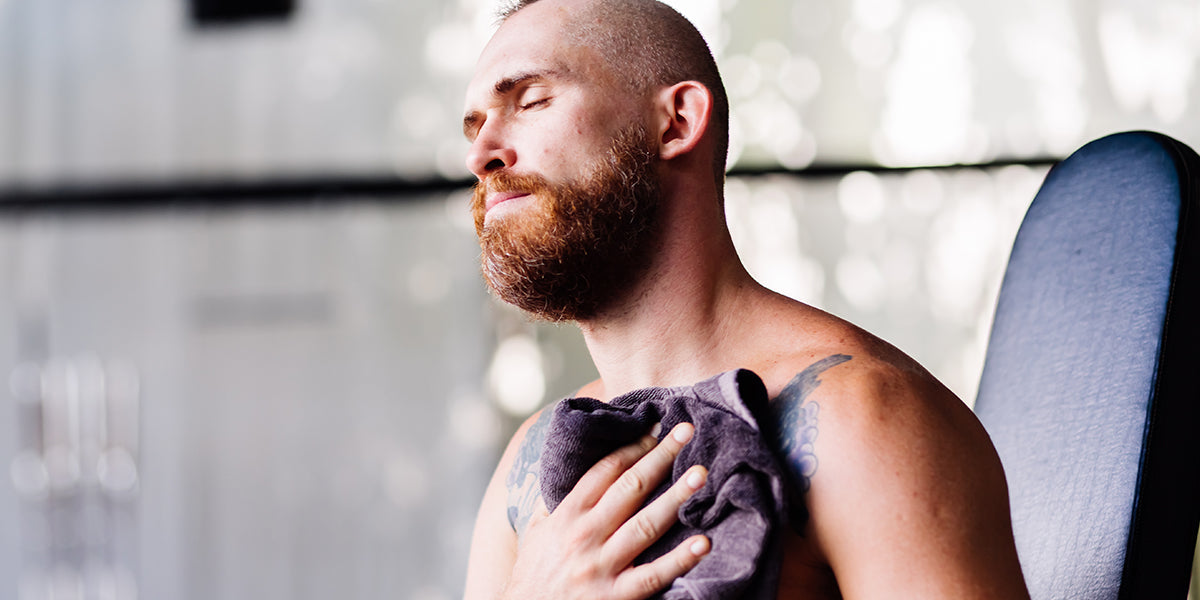 A man struggling from beard summer sweat.